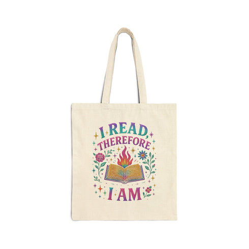 Natural cotton canvas tote bag featuring a vibrant, double-sided print that reads “I Read Therefore Therefore I Am” with a flaming book, stars, and flowers in a colorful pastel palette. Styled against street art backdrops, worn with playful, alternative fashion. A bold, bookish accessory for literary lovers, pastel goths, and dopamine-dressed readers who carry their brainy attitude everywhere.