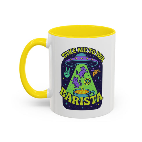 White ceramic coffee mug with a bright yellow handle and interior, featuring a printed alien abduction design with two purple cats, peace signs, and the phrase “Take Me to Your Barista” in green and purple text.