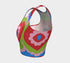 A sleeveless scoop neck crop top featuring a bold all-over printed design. The central graphic is a large bright red heart enclosing a scalloped pink flower shape and a blue evil eye motif in the middle. The background surrounds the heart with mirrored concentric wavy arches and scalloped borders in vibrant shades of lime green, pink, blue, and red. The fitted garment has a smooth athletic texture. Available in a standard matte performance knit or a sparkly silver glitter foil finish.
