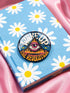 A round pinback button featuring a retro psychedelic design. The central focus is a stylized Eye of Providence in a pink triangle, surrounded by vibrant orange and yellow flames. Behind the triangle are teal and petrol blue sunburst rays. The text "WAKE UP" curves across the top in cream wavy letters, and "THE REVOLUTION" curves along the bottom in orange. The button has a glossy finish and is available in 1.75 inch or 2.25 inch sizes.