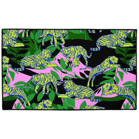 Vibrant doormat featuring stylized yellow tigers with blue stripes amidst green foliage and pink accents on a black background. Bold, maximalist design for indoor/outdoor use.