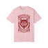 Vintage style graphic t-shirt with a large snarling wolf face printed in dark charcoal ink. A curved banner above reads RAISED BY WOLVES and a banner below reads RADICALIZED BY LEGISLATION, framed by stylized flames and scattered stars. Classic crewneck short sleeve cotton tee with a relaxed fit and seamless sides, available in soft pink, pale green, and ivory. Feminist protest apparel and activist statement tee for reproductive rights, marches, and everyday quiet rage.