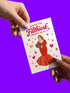 A 5x7 inch pearlescent silver greeting card featuring a flat vector illustration of the drag queen Divine in a red mermaid gown holding a heart-shaped box of chocolates. The text above reads "You're The Filthiest Person Alive" in bold red script with pink sparkles. The card has a shimmering finish that reflects light. Inside text reads "...and I love it." The back features the Honey Dazed logo. Includes a matching envelope.