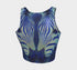 A women's sleeveless, high-neck crop top made from a performance spandex knit fabric. The top is designed with a body-hugging fit and features a striking, symmetrical digital graphic of a zebra's face. The intricate print uses shades of electric blue, cobalt, and navy, contrasted with a shimmering silver glitter effect that outlines the zebra's stripes and features. The psychedelic, futuristic design covers the entire front of the shirt.