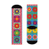 A pair of bright crew socks featuring a vibrant 70s-style maximalist patchwork design. The 2D flat print includes a collage of bold floral motifs in purple, lime green, red, and yellow set against alternating sky blue and light pink square panels. Features a red and white sawtooth border at the cuff and a vertical red scalloped stripe. Reinforced solid black toe and heel. High-quality accessory from black owned shops.