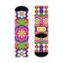 Mid-calf crew sock with a bold 70s psychedelic floral print. The design mixes a red and white diagonal checkerboard with oversized retro flowers, including white daisies with bright yellow centers and a large hot pink bloom with a white inner layer, set over a royal blue background with green leafy foliage. The toe and heel are solid black. The fabric is a soft, stretchy printed knit, made as a one-size unisex statement sock for maximalist and dopamine dressing looks.
