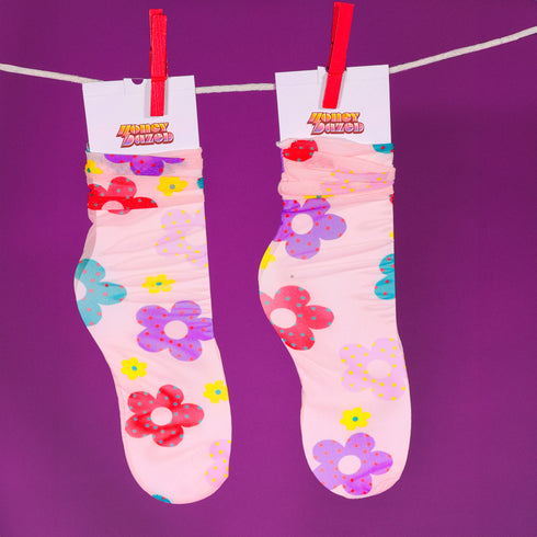 a pair of socks hanging on a clothes line