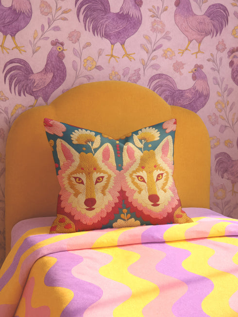 Maximalist pillow cover featuring mirrored twin wolves framed by floral folk-art motifs. Linen-feel textured polyester with saturated double-sided print in gold, blush, coral, teal and mustard on a deep ground. Hidden zipper; machine-washable. Available in 18x18 and 22x22 inches. Pillowcase only. Whimsigoth, lodgecore, alt animal décor.