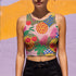 Vibrant Y2K maximalist crop top featuring bold tropical pineapples, leopard print, sweet cherries, and geometric patterns in bright yellow, pink, green, and blue colors. Perfect festival rave wear, alternative fashion, and retro summer styling for women who love aesthetic streetwear and unique party outfits
