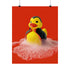 A spooky-yet-cute art print of a vampire-themed rubber duck dressed in a red-lined black cape and bowtie. Surrounded by white bath bubbles, the duck is framed in a red wavy-edged frame and held up against a burnt orange wall by a hand in a dramatic red sleeve.