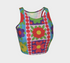 A high-resolution product photo of a body-hugging, 2D printed crop top with a 1970s-inspired floral patchwork pattern. The design consists of vibrant squares in cobalt blue, pale lavender, and deep violet, separated by pink borders with red dots. Central motifs include yellow daisies with orange centers and green-magenta floral mandalas. The top is made of a smooth, high-stretch performance knit fabric with curved back armholes and a cropped waistline.