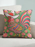Square throw pillow cover with a printed faux embroidery design of a rooster wearing a white cowboy hat with red stars on a grass green background. The western chicken has a red comb and wattle, yellow beak and feet, and layered feathers in pink, green, orange, blue, and yellow with a rainbow striped tail. Pink and red flowers with yellow centers frame the bird. The stitched look is a flat 2D print on a smooth linen feel polyester cover with a hidden zipper, not raised embroidery.