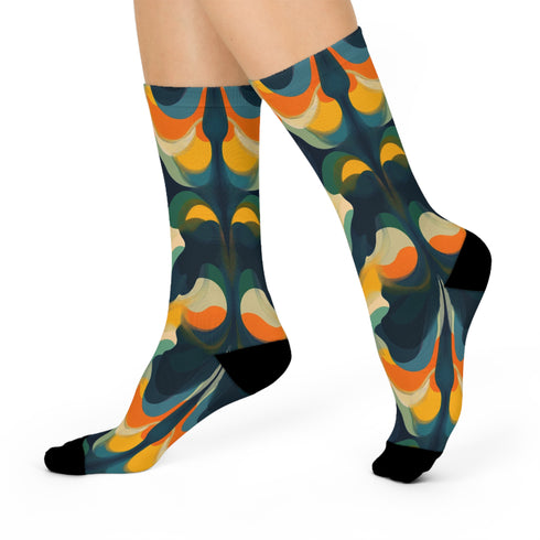 Crew socks featuring a bold ‘70s-style abstract swirl pattern in deep green, orange, yellow, and navy blue.