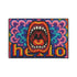 A rectangular indoor and outdoor doormat featuring a vibrant, psychedelic design. The central graphic is a large, open screaming red and orange mouth with white teeth, surrounded by highly saturated wavy, trippy patterns in blue, purple, magenta, and teal. Yellow stylized text reading HELLO is integrated into the pattern. The mat has a smooth 2D flat print surface that mimics the look of textured chainstitch embroidery, finished with a solid black fabric trim around all four outer edges.