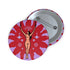 Circular pin featuring a nude goddess figure in gold against a red sunburst pattern on lavender background, with moon and star details