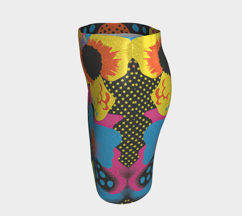 A colorful, patterned skirt with a mix of polka dots, stripes, and floral designs in various bright colors such as yellow, orange, blue, and pink.