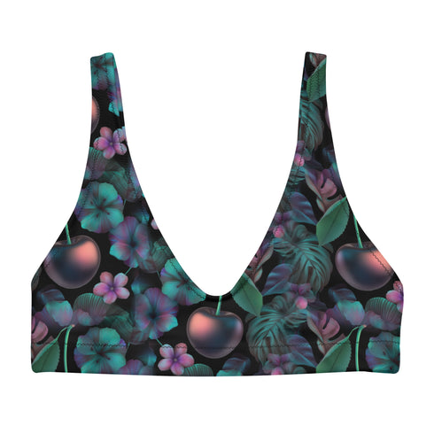Black Cherry floral bikini top with deep V neckline, bold pink and purple tropical flowers, glossy leaves, and subtle fruit pattern. Made with recycled polyester and LYCRA, removable padding, double-layered, available in sizes XS to 3XL, features UPF 50 plus sun protection, non-reversible. Designed for festival, rave, and retro summer swim looks.