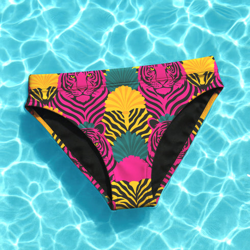 Tropical tiger print bikini bottom with vibrant pink, yellow, and teal psychedelic design. Mid-rise cut with cheeky coverage, double-layered fabric, UPF 50+, and soft, stretchy recycled polyester-spandex blend.