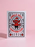 A 5x7 pearlescent shimmer folded greeting card featuring the Jingle Hell Survivors Club design. The front is a illustration of a grumpy red devil imp character, wearing a small Santa hat, holding a coffee cup, and a circular 'I Tried' merit badge. The overall aesthetic is maximalist dark humor and spooky cute. This anti-Christmas card is perfect for those needing relief from holiday stress. Inside text references surviving tolerable relatives, strong eggnog, and merciful hangovers.