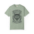 Vintage style graphic t-shirt with a large snarling wolf face printed in dark charcoal ink. A curved banner above reads RAISED BY WOLVES and a banner below reads RADICALIZED BY LEGISLATION, framed by stylized flames and scattered stars. Classic crewneck short sleeve cotton tee with a relaxed fit and seamless sides, available in soft pink, pale green, and ivory. Feminist protest apparel and activist statement tee for reproductive rights, marches, and everyday quiet rage.