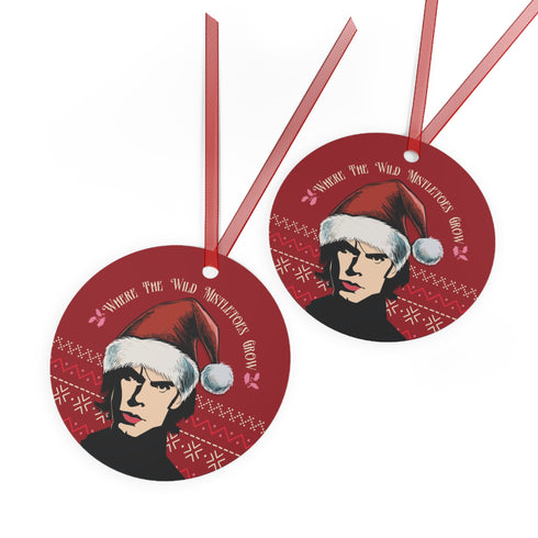 "Round red metal Christmas ornament featuring Nick Cave in black and white with Santa hat, Nordic patterns, and 'Where The Wild Mistletoes Grow' text, suspended by red ribbon