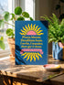 A hardcover spiral planner for 2027 with a dark blue cover and retro 70s style graphics. The title reads "2027 SHITSHOW All-Seeing Agenda" in bold yellow and pink text. Below the title is a large, stylized all-seeing eye with pink rays emanating from it. At the bottom, a pink ribbon contains the text "BLINK TWICE FOR MERCY." The back cover is also dark blue with a yellow sun graphic and the text "Plans bloom. Deadlines hum. I write, I wander, then get it done. Keep receipts. Keep grace.