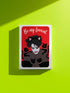 A vertical greeting card featuring a flat vector illustration of Robert Smith from The Cure against a vibrant red background. He has messy black hair, pale skin with smeared lipstick, and wears black cat ears. He is surrounded by four black cats with pink collars. White script text at the top reads "Be my Lovecat." The card is printed on shimmery pearlescent cardstock that catches the light. A high-quality alternative Valentine or anniversary card for goth music lovers and post-punk fans.