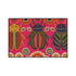 A rectangular doormat featuring a vibrant hot pink background with a high-fidelity tapestry-style print of three large, detailed beetles. The central beetle is emerald green and gold with navy accents, flanked by two side-profile beetles in ochre and deep blue. Stylized teal and yellow sunburst flowers and small sage green leaves are scattered throughout the design. The mat has a sleek black-trimmed edge and a visible flat, durable polyester texture mimicking intricate needlework.
