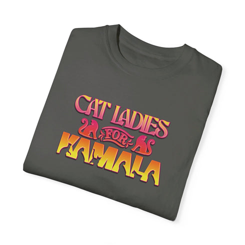 Faded vintage Black t-shirt with "Cat Ladies for Kamala" in retro-style pink and yellow lettering. Cat silhouettes accent the text.