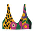 Scoop-neck bikini top with thick straps and a vibrant retro flower print in yellow, pink, green, and black. Features a secure, supportive sports-bra style fit. Shown above a bright turquoise pool, this top channels a maximalist 70s energy with bold color blocking and playful floral design. Ideal for statement swimwear, retro summer fashion, and festival season looks.
