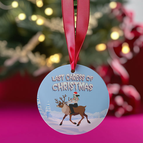 Round blue metal Christmas ornament featuring Glenn Danzig in sunglasses and Christmas lights riding reindeer through snowy landscape. Text reads "Last Caress of Christmas" in icy font.