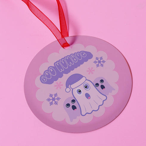 Round pastel purple metal Christmas ornament featuring kawaii ghost in Santa hat with two smaller ghost friends and snowflakes. Text reads "Boo Humbug" in bubble letters.