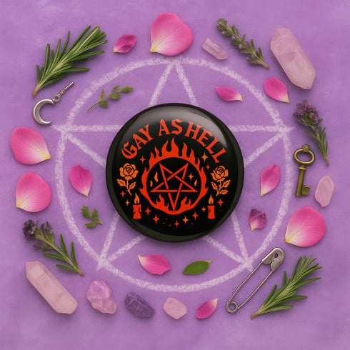 Round glossy pinback button measuring 2.25 inches with bold red graphic design on a black background. Text reads “Gay As Hell” above a red pentagram surrounded by flames, stars, roses, and candles. Made of tinplate with a safety pin back and a scratch-resistant mylar finish. The button features a high-gloss surface and is lightweight and durable, perfect for jackets, bags, or accessories.