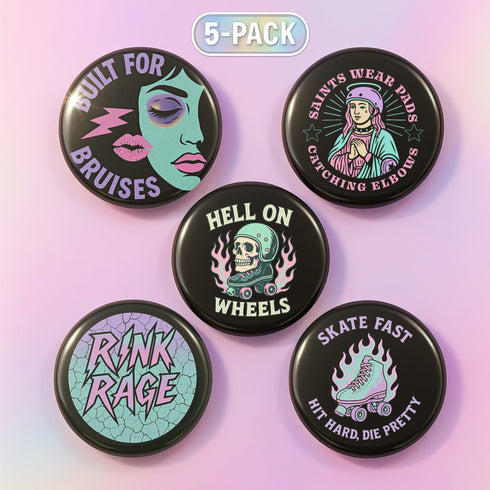 A set of five round 2.25-inch pinback buttons featuring original roller derby designs including a bruised face, saint on skates, flaming roller skate, skull in helmet, and bold text phrases like “Built for Bruises” and “Hell on Wheels.” Each button has a glossy black finish with vibrant pastel pink, purple, mint, and aqua artwork, mounted on metal tinplate with a safety pin back.