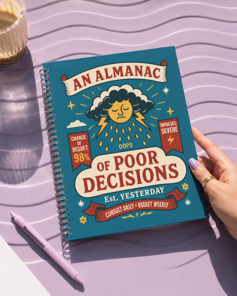 A spiral-bound hardcover planner featuring a retro-style teal cover with the text "An Almanac of Poor Decisions" in bold red and cream typography. The cover includes a grumpy cloud raining down lightning bolts, alongside stars, flowers, and vintage banners. The interior reveals crisp white pages with a 2026 to 2027 year-at-a-glance spread, plus clean, minimalist, completely undated monthly and weekly calendar grids with dedicated sections for writing daily to-do lists and random notes.