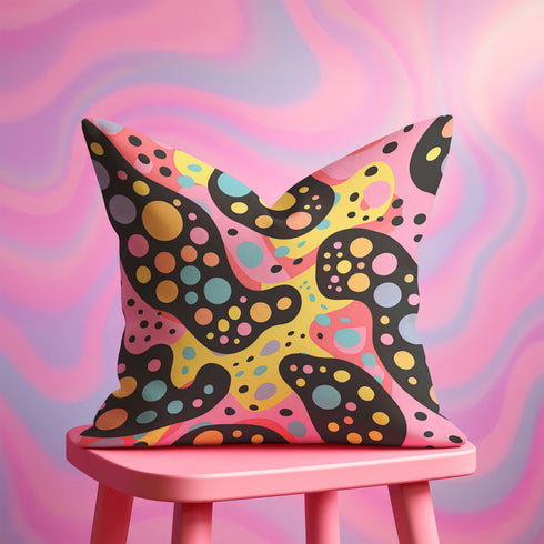 Psychedelic polka dot pillow cover with abstract swirls and colorful circles in pastel pink, yellow, aqua, and black. The pattern features bubbly, wavy shapes resembling pop art and retro lava lamp vibes. Made of durable polyester with a soft linen texture, shown on a pink background. Double-sided full-color design with hidden zipper. Available in 18x18 and 22x22 sizes. Bold dopamine decor for maximalist spaces.