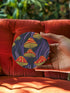 Round ceramic coaster featuring orange and yellow mushrooms with striped caps against a dark background with flowing purple lines in a psychedelic 70s style