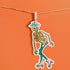 A sticker featuring a whimsical skeleton dressed in a green cowboy hat, casually posed with one leg propped up. The skeleton sports a full grin and is adorned with vibrant teal and orange roller skates, adding a playful and surreal touch to the design.