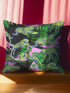 Square pillow cover featuring neon chartreuse tigers with cobalt blue stripes lounging among emerald green palm fronds on a black background with pink geometric accents.