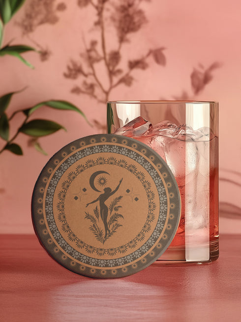 Round ceramic coaster featuring a silhouetted dancing figure reaching for a crescent moon, surrounded by concentric rings of stars and botanical patterns in terracotta and umber tones