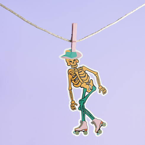 A sticker featuring a whimsical skeleton dressed in a green cowboy hat, casually posed with one leg propped up. The skeleton sports a full grin and is adorned with vibrant teal and orange roller skates, adding a playful and surreal touch to the design.