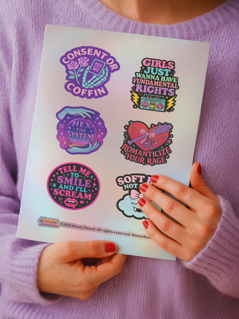 Feminist sticker sheet measuring 9.8x14 inches featuring 6 kiss-cut vinyl stickers with matte finish. Includes designs: “Consent or Coffin” (4.1x4), “Girls Just Wanna Have Fundamental Rights” (3.5x4.1), “Hex the System” (3.6x3.7), “Romanticize Your Rage” (3.7x3.3), “Tell Me to Smile and I’ll Scream” (3.6x3.6), and “Soft But Not Sorry” (~3.3"). Weather-resistant, semi-permanent adhesive, ideal for laptops, water bottles, and journals.