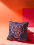 Square woven pillow featuring a fierce pink tiger with bared fangs against electric blue background surrounded by psychedelic jungle leaves. Textured tapestry design creates vibrant maximalist tiger decor perfect for gothic or eclectic home styling.