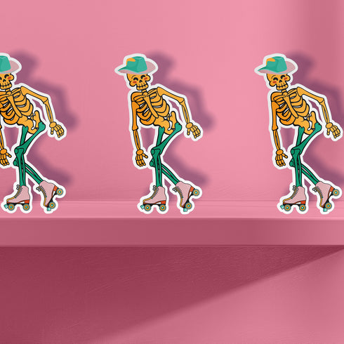 A sticker featuring a whimsical skeleton dressed in a green cowboy hat, casually posed with one leg propped up. The skeleton sports a full grin and is adorned with vibrant teal and orange roller skates, adding a playful and surreal touch to the design.