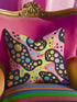 Psychedelic polka dot pillow cover with abstract swirls and colorful circles in pastel pink, yellow, aqua, and black. The pattern features bubbly, wavy shapes resembling pop art and retro lava lamp vibes. Made of durable polyester with a soft linen texture, shown on a pink background. Double-sided full-color design with hidden zipper. Available in 18x18 and 22x22 sizes. Bold dopamine decor for maximalist spaces.