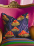 Square pillow cover featuring a bold retro pattern of orange and red striped mushrooms with yellow gills against a navy background with flowing purple lines.