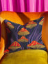 Square pillow cover featuring a bold retro pattern of orange and red striped mushrooms with yellow gills against a navy background with flowing purple lines.