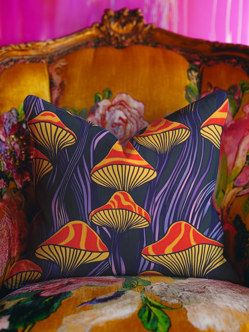 Square pillow cover featuring a bold retro pattern of orange and red striped mushrooms with yellow gills against a navy background with flowing purple lines.
