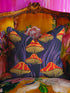 Square pillow cover featuring a bold retro pattern of orange and red striped mushrooms with yellow gills against a navy background with flowing purple lines.