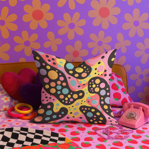 Psychedelic polka dot pillow cover with abstract swirls and colorful circles in pastel pink, yellow, aqua, and black. The pattern features bubbly, wavy shapes resembling pop art and retro lava lamp vibes. Made of durable polyester with a soft linen texture, shown on a pink background. Double-sided full-color design with hidden zipper. Available in 18x18 and 22x22 sizes. Bold dopamine decor for maximalist spaces.